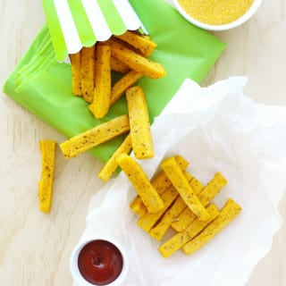 Easy Baked Polenta Fries / Chips Recipe - healthy, vegan, seasoned with dried mixed herbs, nutritional yeast, garlic & onion powder, and a few other yummy ingredients. #polenta #chips #fries #vegan #healthy #polentachips #polentafries