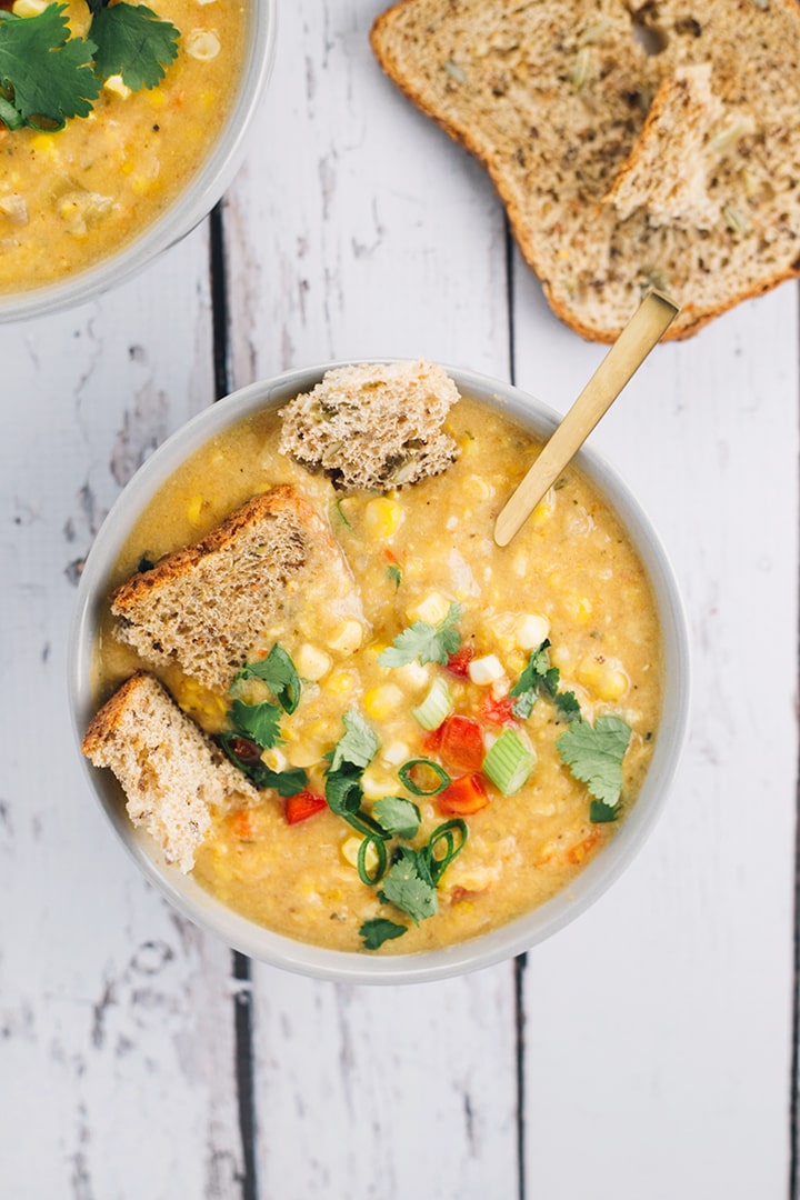 Creamy Vegan Corn Chowder - a quick, simple and healthy soup made with corn, potatoes, celery and red pepper. #vegan #chowder #creamy #corn #soup #hearty #veganrecipe #simple #healthy