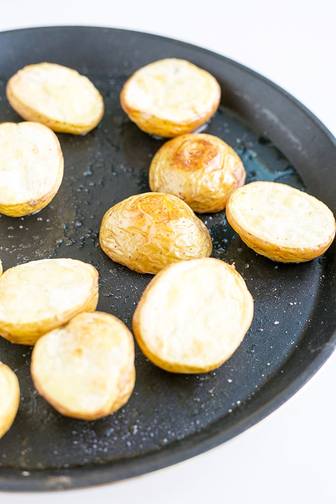 Vegan Deviled Potato Bites - A vegan version of Deviled Eggs. Homemade Hummus piped into Roasted Potatoes. #vegan #healthy #glutenfree #deviledeggs #simple #cheap