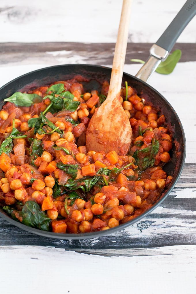 Vegan Spanish Chickpea And Sweet Potato Stew - healthy, hearty, and made in under 45 minutes. #vegan #recipes #veganfood #healthy #delicious #chickpeas #spinach #stew 