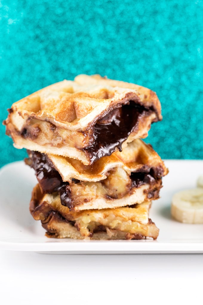 Vegan Waffled Nutella Banana Sandwich - Homemade Vegan Nutella, Banana and Bread pressed in a waffle iron. Simple, Easy, So Sinful. #vegan #nutella #waffled #sandwich #banana #vegetarian #dessert #breakfast