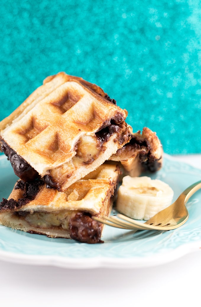 Vegan Waffled Nutella Banana Sandwich - Homemade Vegan Nutella, Banana and Bread pressed in a waffle iron. Simple, Easy, So Sinful. #vegan #nutella #waffled #sandwich #banana #vegetarian #dessert #breakfast