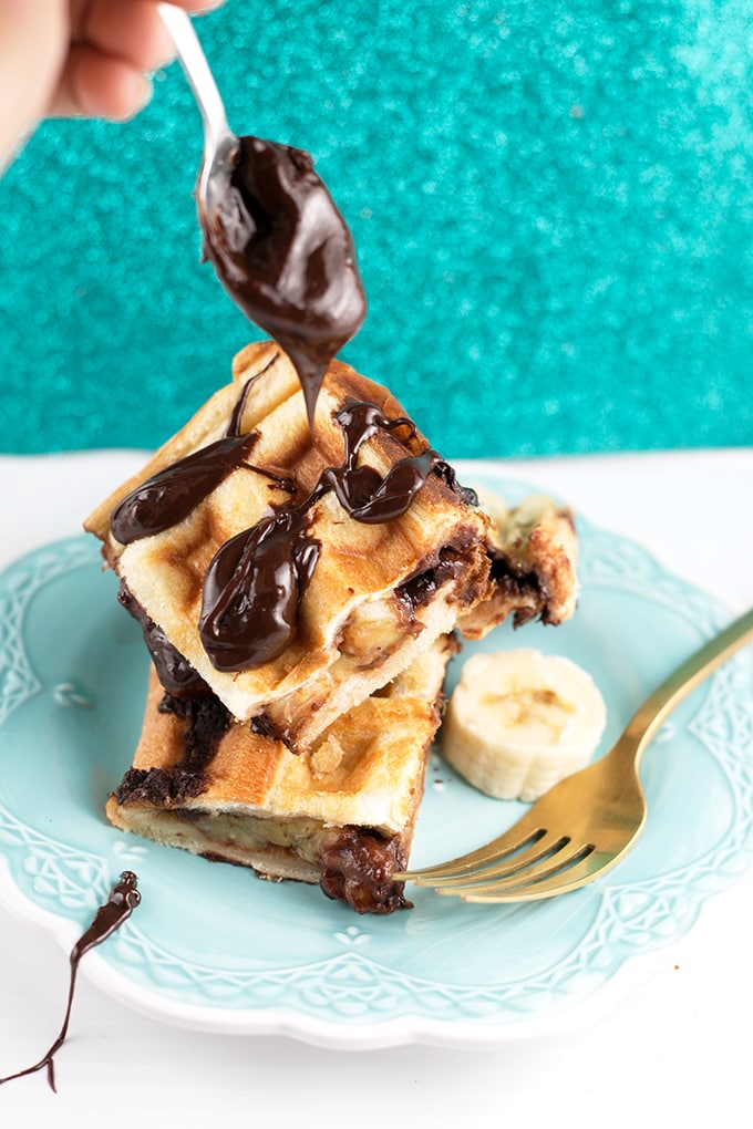 Vegan Waffled Nutella Banana Sandwich - Homemade Vegan Nutella, Banana and Bread pressed in a waffle iron. Simple, Easy, So Sinful. #vegan #nutella #waffled #sandwich #banana #vegetarian #dessert #breakfast