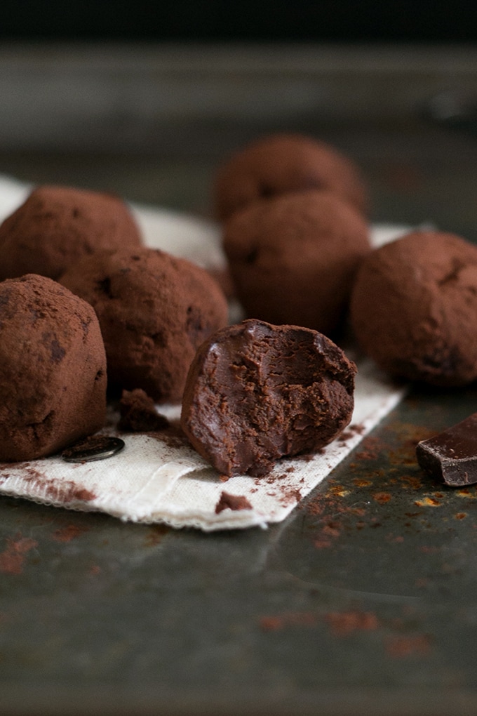 Simple Vegan Chocolate Truffles made with Dark Chocolate, Coconut Cream, Maple Syrup Sea Salt, Espresso and Vanilla Bean. Easy to make, decadent, yum. #CHOCOLATE #vegan #delicious #truffles #simple #dairyfree #easy #coconut #darkchocolate #recipes