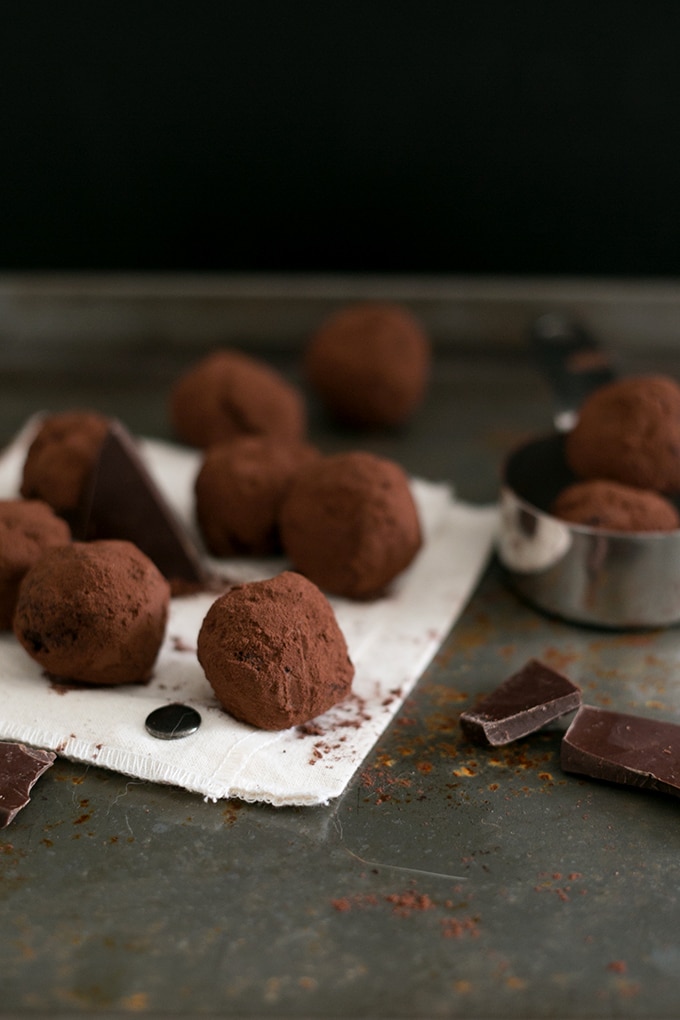 Simple Vegan Chocolate Truffles made with Dark Chocolate, Coconut Cream, Maple Syrup Sea Salt, Espresso and Vanilla Bean. Easy to make, decadent, yum. #CHOCOLATE #vegan #delicious #truffles #simple #dairyfree #easy #coconut #darkchocolate #recipes