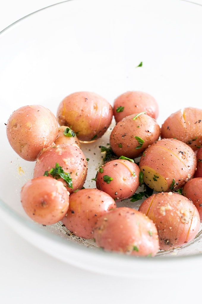 Simple Vegan Lemon Garlic Herb Roasted Potatoes - simple to make, only a handful of ingredients, and ready in under an hour.#POTATOES #roasted #herb #lemon #garlic #healthy #vegan #recipes