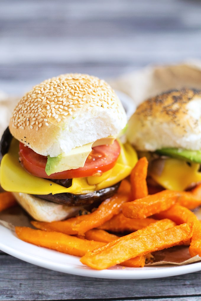 Simple Vegan Portobello Mushroom Burgers with Sweet Onions, Avocado, Tomato and Vegan Cheese. Inexpensive, Simple To Make And Full Of Flavor. #vegan #mushroom #burgers #veganburger #simple #portobellomushroom #recipes 