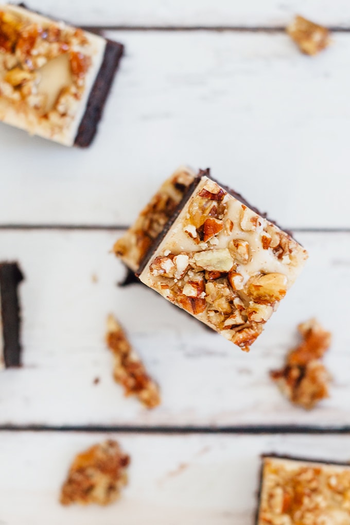 Vegan Cheesecake Brownies with Pecan Praline - Vegan Fudge Brownie, Vanilla Bean Cashew Cheesecake and Pecan Praline Brittle topping. #vegan #brownie #veganbrownie #cheesecake #cheesecakebrownies #delicious #chocolate