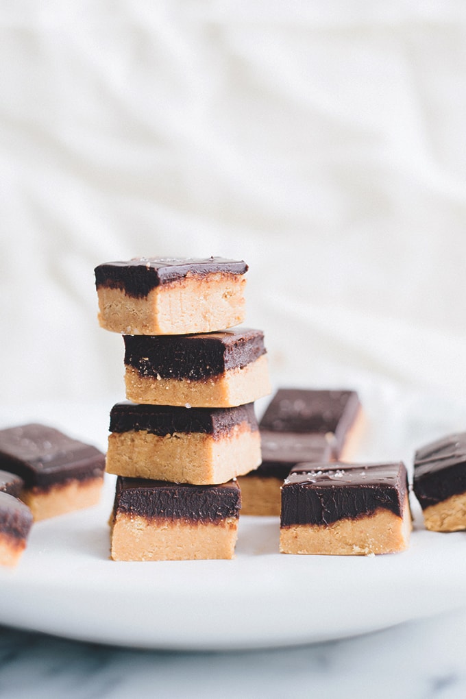 No Bake Vegan Chocolate Peanut Butter Slice - A delicious, rich and creamy treat that doesn't require any baking. Peanut Butter Base and silky Chocolate Ganache Topping. #vegan #vegetarian #dairyfree #peanutbutter #chocolate #bars #easy #simple