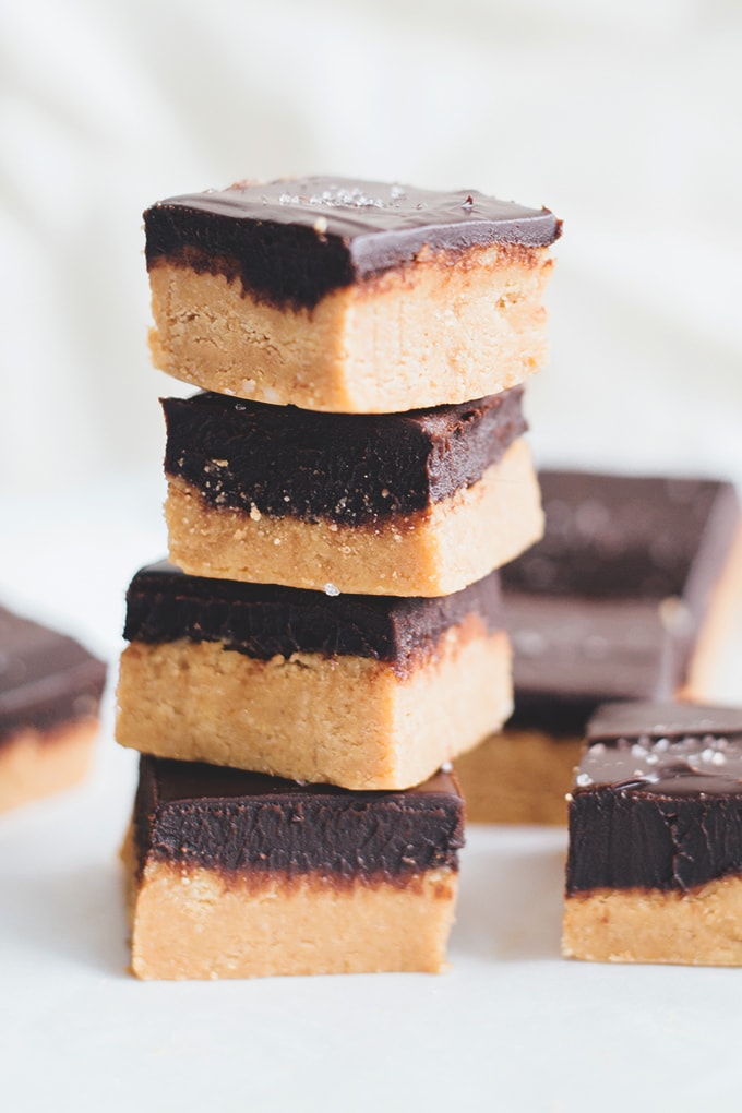 No Bake Vegan Chocolate Peanut Butter Slice - A delicious, rich and creamy treat that doesn't require any baking. Peanut Butter Base and silky Chocolate Ganache Topping. #vegan #vegetarian #dairyfree #peanutbutter #chocolate #bars #easy #simple