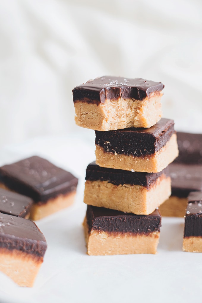 No Bake Vegan Chocolate Peanut Butter Slice - A delicious, rich and creamy treat that doesn't require any baking. Peanut Butter Base and silky Chocolate Ganache Topping. #vegan #vegetarian #dairyfree #peanutbutter #chocolate #bars #easy #simple