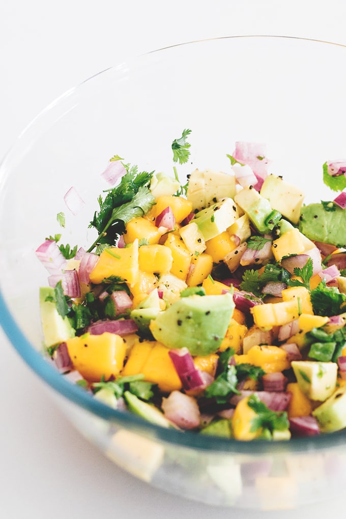 Easy 5 Minute Mango Avocado Salsa with Red Onion, Lime and Jalapeno. Perfect with corn chips or on tacos. #vegan #salsa #mango #avocado #healthy #easy #taco #chips