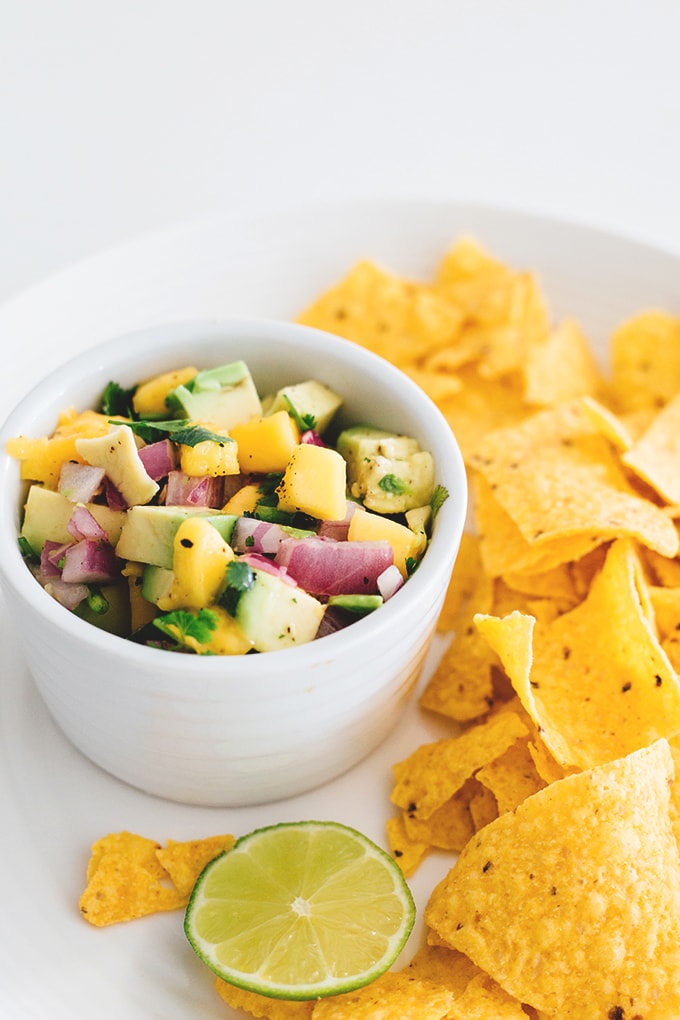 Easy 5 Minute Mango Avocado Salsa with Red Onion, Lime and Jalapeno. Perfect with corn chips or on tacos. #vegan #salsa #mango #avocado #healthy #easy #taco #chips