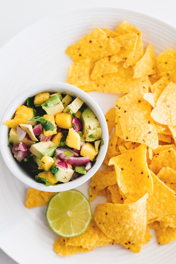 Easy 5 Minute Mango Avocado Salsa with Red Onion, Lime and Jalapeno. Perfect with corn chips or on tacos. #vegan #salsa #mango #avocado #healthy #easy #taco #chips