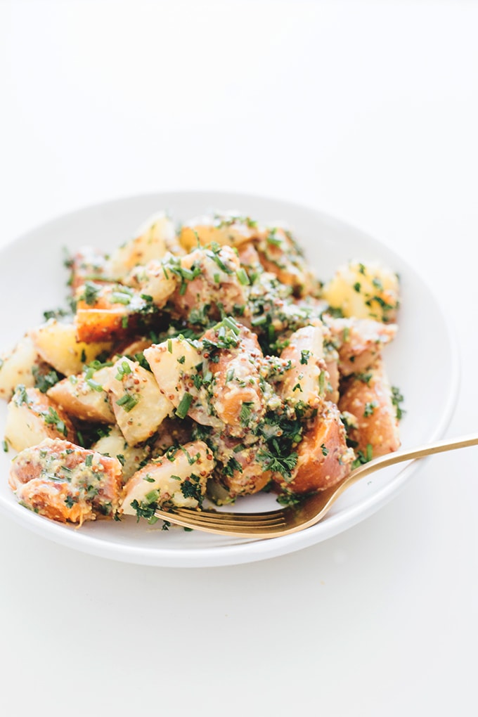 Healthy Vegan Herbed Potato Salad - a delicious salad loaded with Potatoes, Sweet Potatoes and a tangy Mustard and Herb Dressing. #vegan #healthy #delicious #potatosalad #herbs #simple #quick #veganrecipes