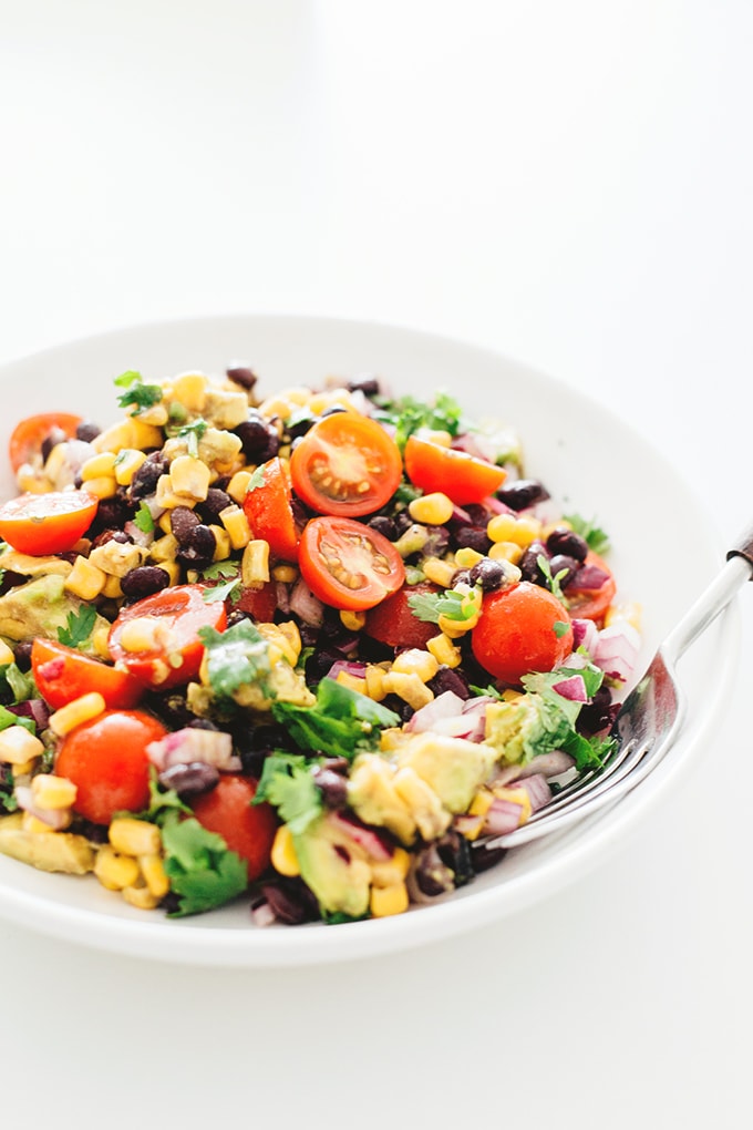 A healthy and delicious Vegan Black Bean Salad with Corn and Avocado In A Tangy Lime Dressing - No-Cook, Full Of Heart Healthy Fat and Loaded With Flavor! #vegan #blackbean #salad #healthy #recipes #vegetarian #corn #delicious