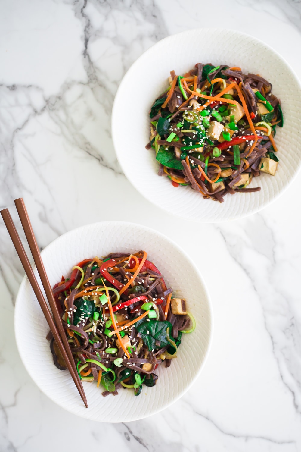 Healthy Vegan Korean Japchae Noodles - A Simple Dish loaded with Vegetables and Zucchini Noodles that is ready in under 30 minutes. #vegan #japchae #korean #noodles #recipe #asian #quick