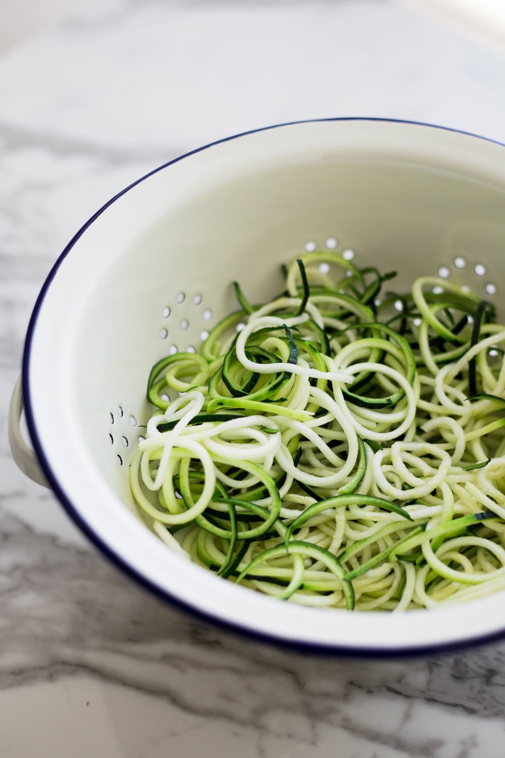 Healthy Vegan Korean Japchae Noodles - A Simple Dish loaded with Vegetables and Zucchini Noodles that is ready in under 30 minutes. #vegan #japchae #korean #noodles #recipe #asian #quick