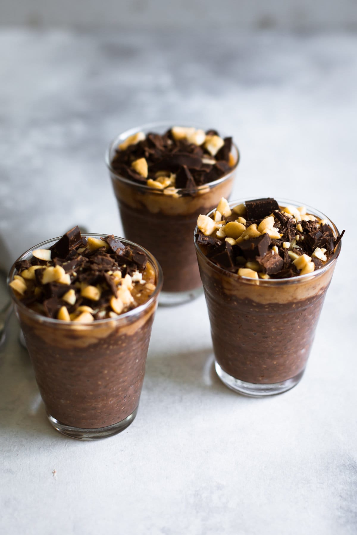 Vegan Snickers Chia Pudding - Chocolate Chia Seed Pudding topped with a Peanut Butter Date Caramel. Dairy Free/Gluten Free/Refined Sugar Free. #vegan #snickers #chiaseed #pudding #chocolate #date #caramel #peanutbutter