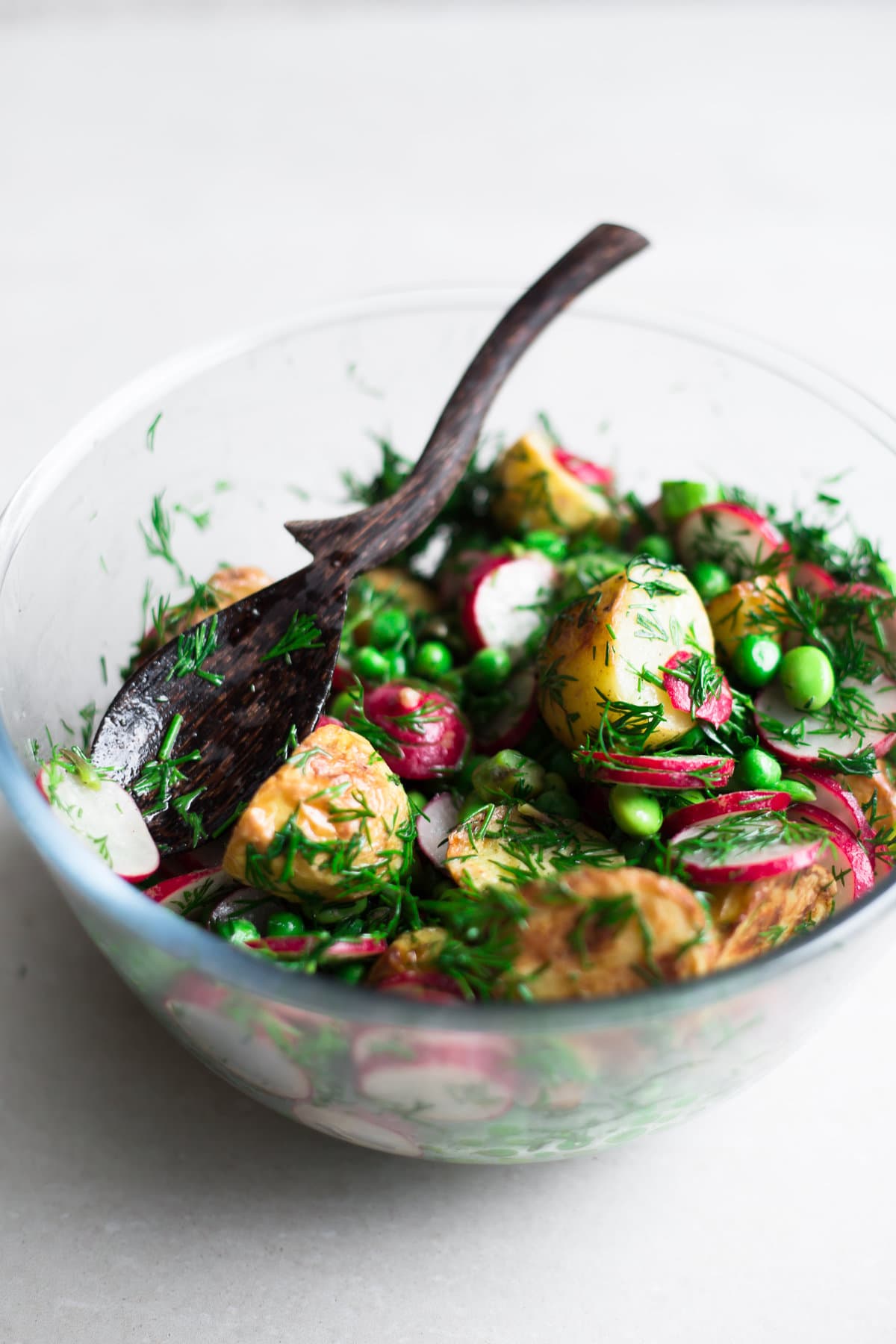 Vegan Spring Potato Salad - A Delicious, Healthy Salad that is low in Fat and packed full of goodness. Asparagus, Potatoes, Green Peas, Edamame, Dill and a Tangy Dressing. Ready in under 30 minutes. Vegan/Gluten Free. #vegan #potatosalad #glutenfree #healthy 