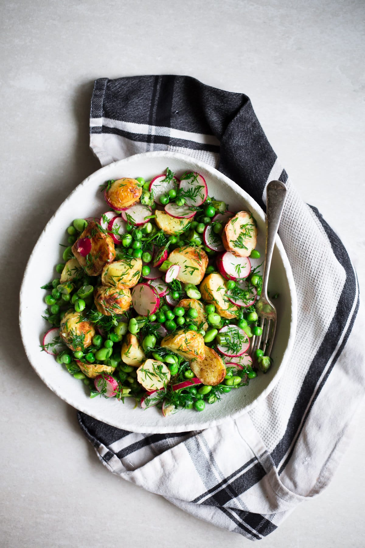 Vegan Spring Potato Salad - A Delicious, Healthy Salad that is low in Fat and packed full of goodness. Asparagus, Potatoes, Green Peas, Edamame, Dill and a Tangy Dressing. Ready in under 30 minutes. Vegan/Gluten Free. #vegan #potatosalad #glutenfree #healthy 