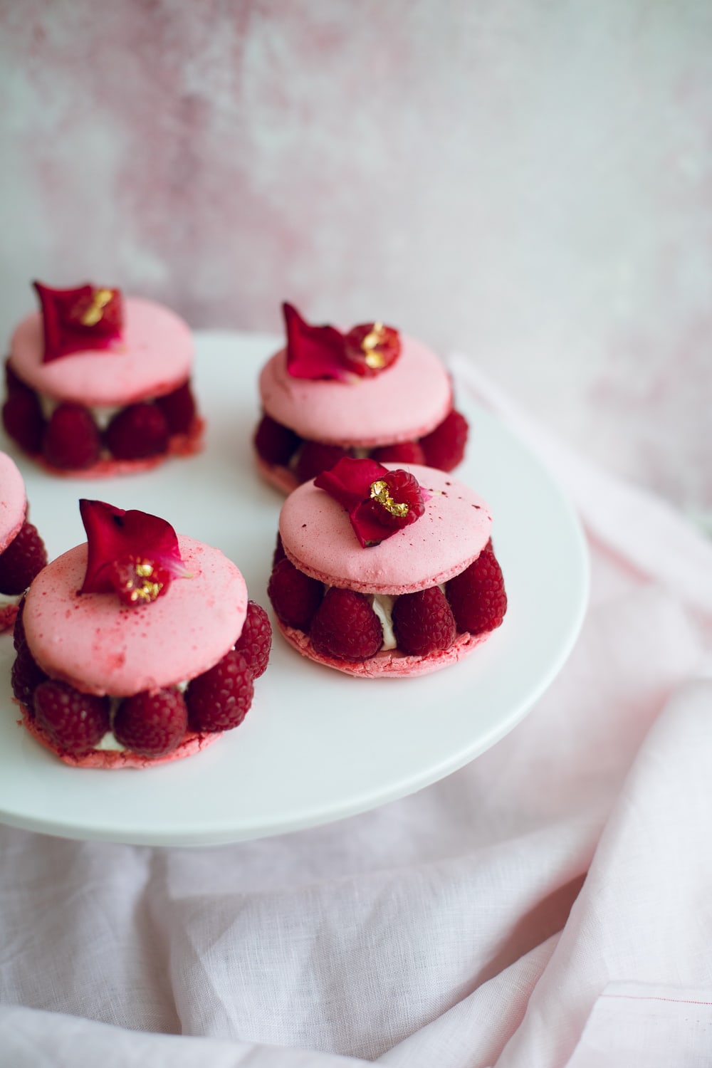 The Vegan Ispahan, made with Italian Meringue Vegan Macarons. Rose Shell, White Chocolate Rose Cream, Lychees and Raspberries. Gluten Free. #glutenfree #veganmacaron #ispahan #vegan #macarons #aquafaba #lychee #rose #raspberry