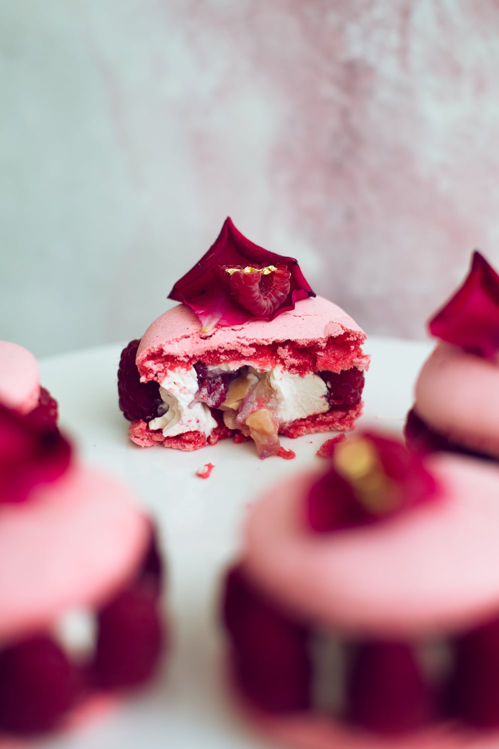 The Vegan Ispahan, made with Italian Meringue Vegan Macarons. Rose Shell, White Chocolate Rose Cream, Lychees and Raspberries. Gluten Free. #glutenfree #veganmacaron #ispahan #vegan #macarons #aquafaba #lychee #rose #raspberry