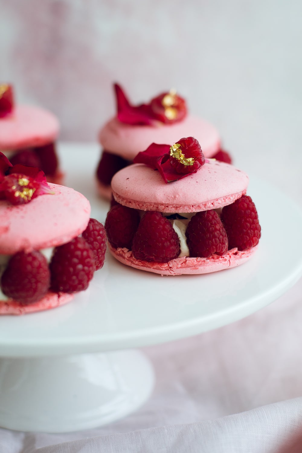 The Vegan Ispahan, made with Italian Meringue Vegan Macarons. Rose Shell, White Chocolate Rose Cream, Lychees and Raspberries. Gluten Free. #glutenfree #veganmacaron #ispahan #vegan #macarons #aquafaba #lychee #rose #raspberry