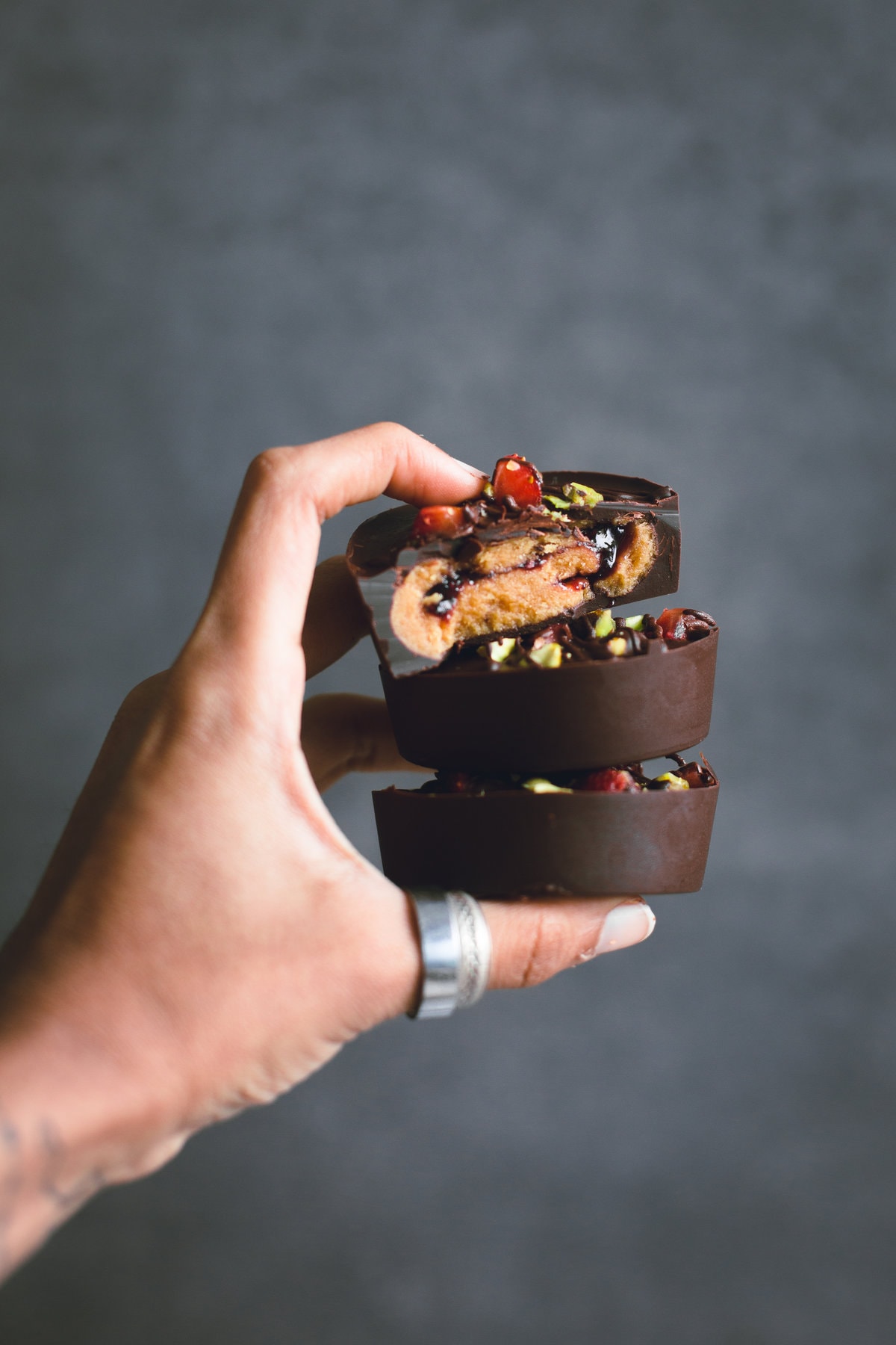 Vegan Peanut Butter and Jelly Cups. A fun variation to the traditional Peanut Butter Cup. 6 Ingredients, 15 minutes to make and all too easy to eat! #vegan #peanutbutter #pbj #jelly #healthy #dairyfree #veganchocolate #peanutbuttercups #simple #easy