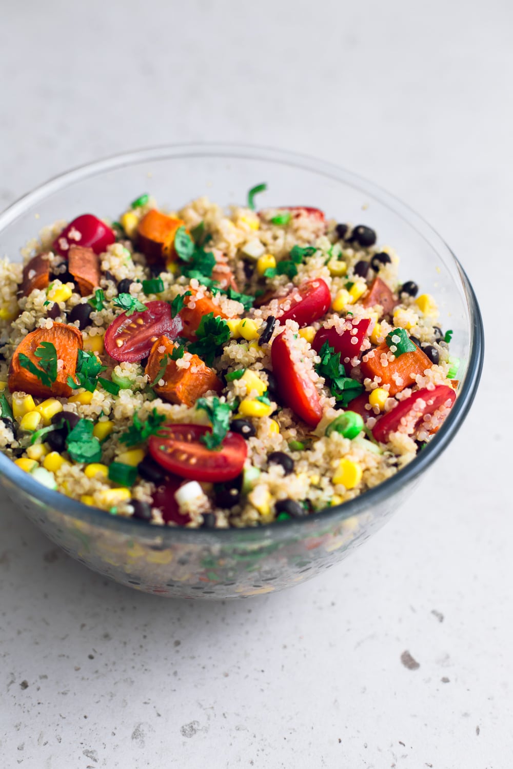 Vegan Detox Quinoa Salad - a healthy, vibrant and delicious salad studded with lots of veggies and dressed in a Lime and Cumin Dressing. Gluten Free. #vegan #quinoa #healthy #sweetpotato #blackbeans #salad #lime #cumin #mexican #healthyrecipes