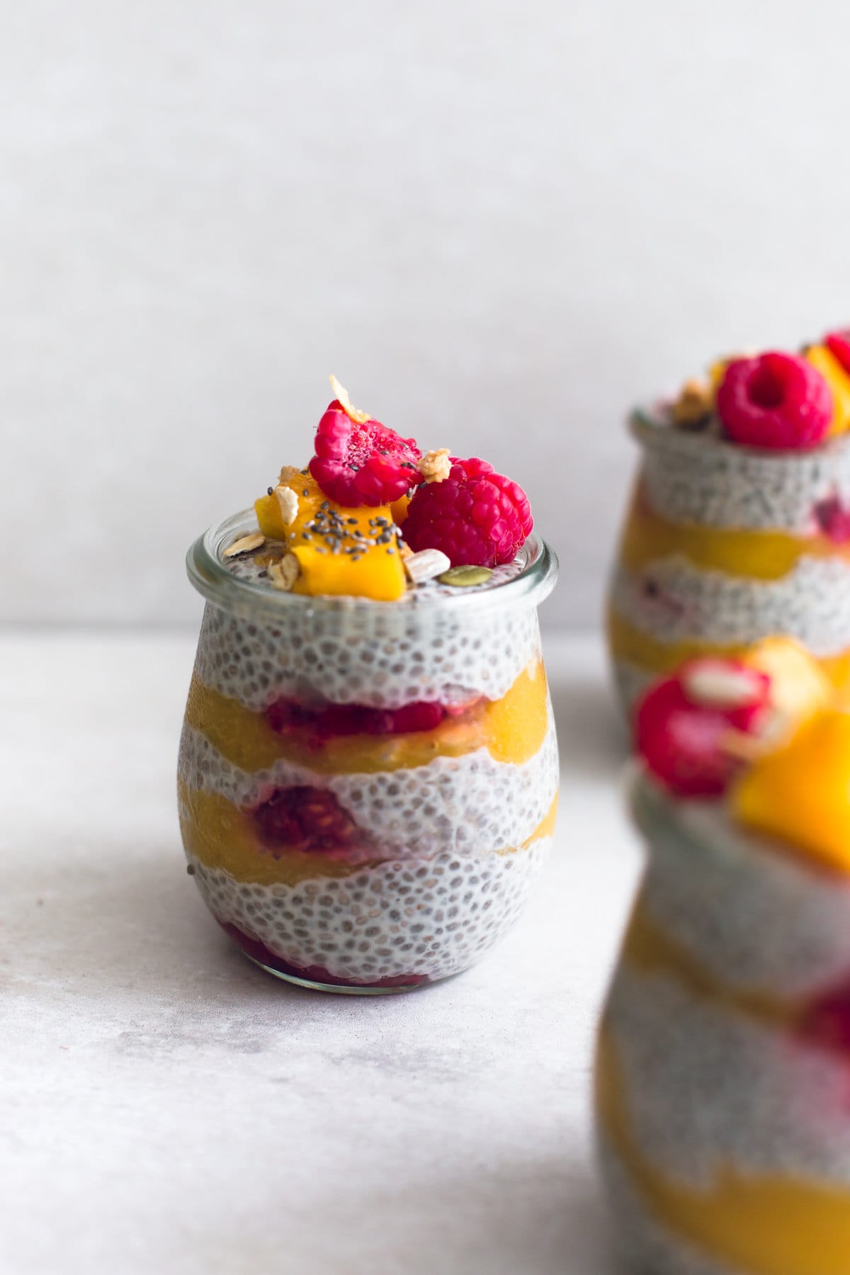 A healthy, fruity and delicious guilt-free Mango Raspberry Chia Seed Pudding. 100% Vegan, Gluten Free and Refined Sugar Free. #mango #raspberry #chia #pudding #refinedsugar #fruit #simple #healthy #breakfast #veganrecipes