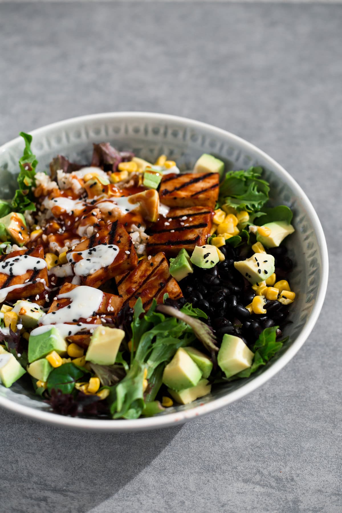 A delicious Vegan Barbecue Bowl loaded with Brown Rice, Avocado, Corn, Black Beans and Smokey Barbecue Tofu. Healthy, delicious, simple. #vegan #bbq #tofu #barbecue #mexican #burritobowl #salad #delicious #healthy #yum