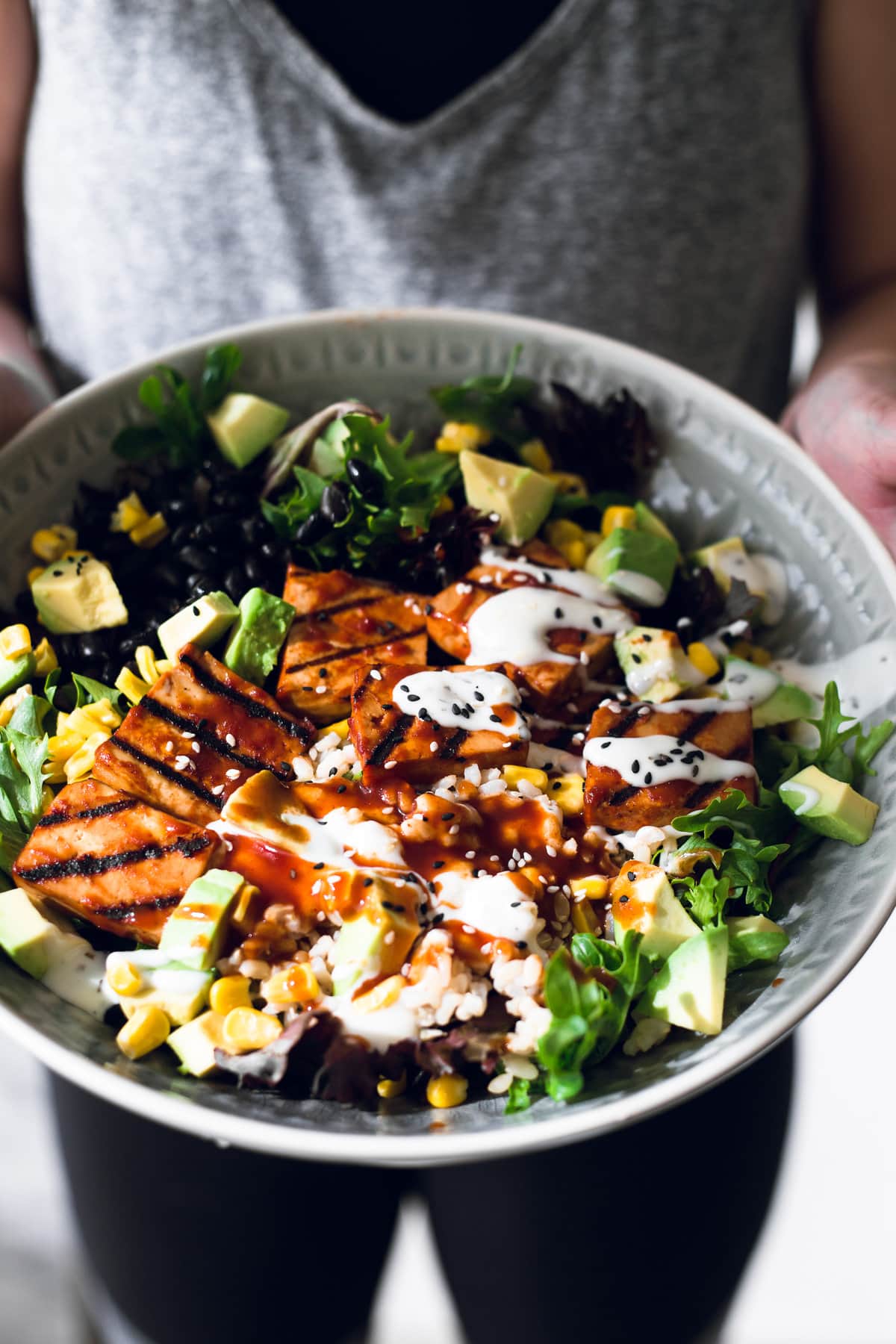 A delicious Vegan Barbecue Bowl loaded with Brown Rice, Avocado, Corn, Black Beans and Smokey Barbecue Tofu. Healthy, delicious, simple. #vegan #bbq #tofu #barbecue #mexican #burritobowl #salad #delicious #healthy #yum