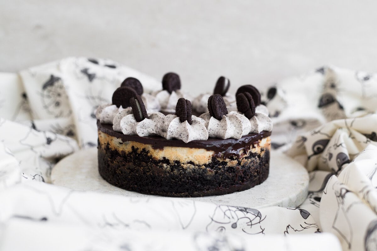 The Ultimate Baked Vegan Cheesecake recipe, so good you'll even fool the omnivores! Easy to make, low in cost and 100% Nut Free/Dairy Free. #dairyfree #bakedcheesecake #vegancheesecake #cheesecake #nutfree #oreocheesecake #veganrecipes #veganbakedcheesecake #simple
