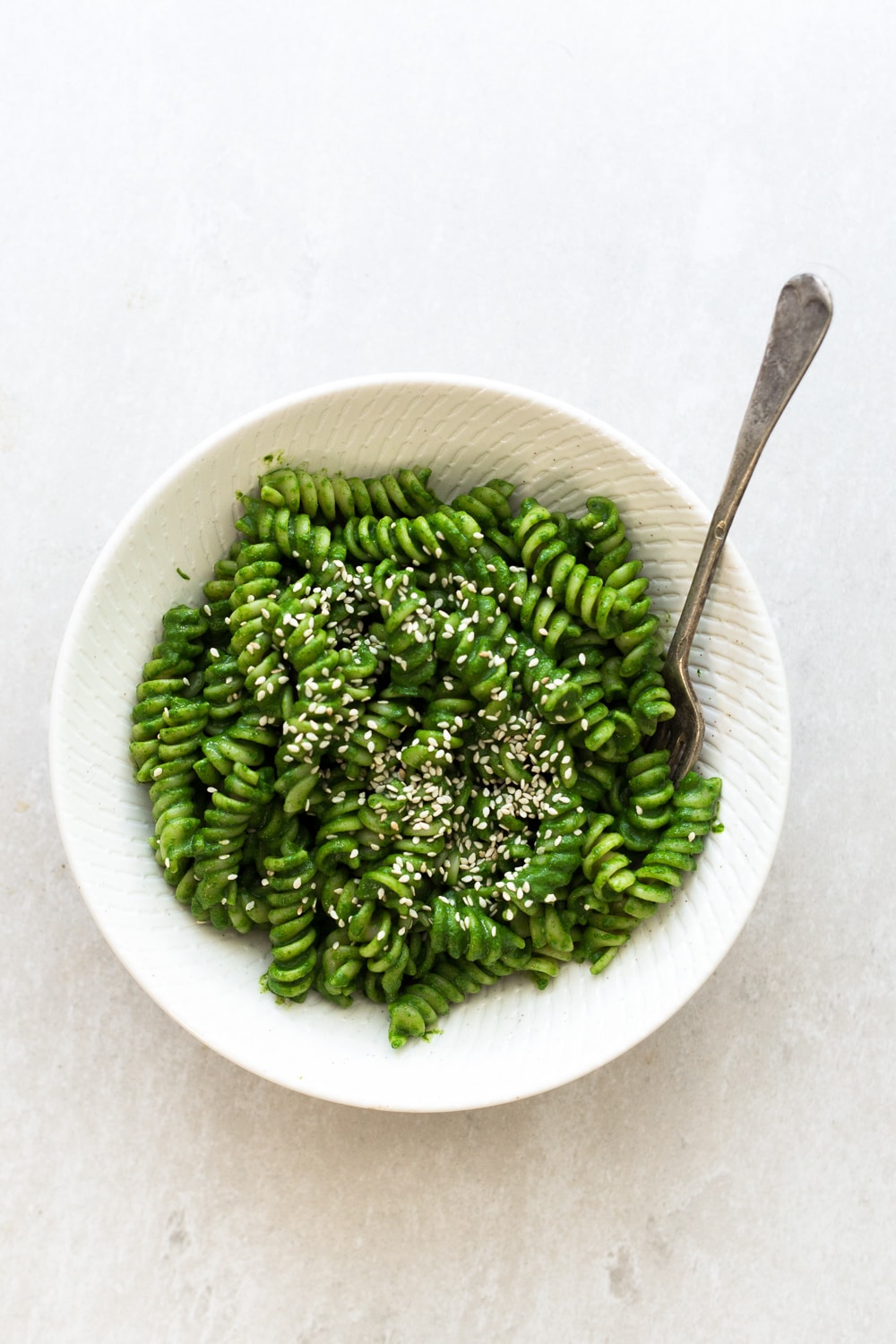 A simple Miso Pesto Pasta recipe made in under 15 minutes. Dairy Free, Vegan and loaded with Baby Spinach and Cilantro. Yum! #vegan #pesto #miso #asian #pasta #veganpesto #pestopasta #healthy #simple #easy #quickrecipes