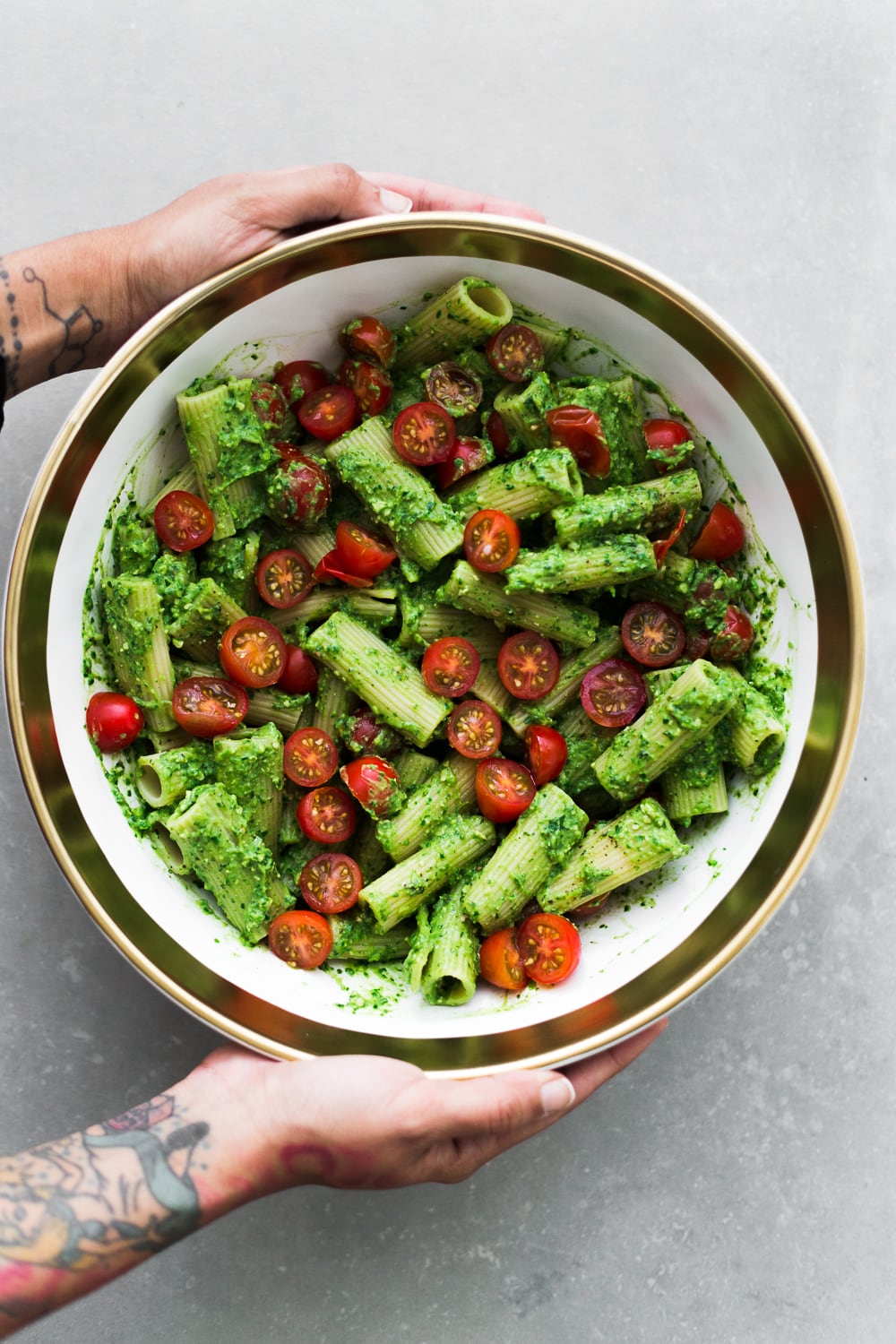 Looking for a quick and simple dinner? Try our this dairy free Avocado Pesto Pasta - ready in under 15 minutes and loaded with bucket fulls of flavor! #vegan #tomato #healthy #avocado #pesto #pasta #simple #quick #pestopasta #dairyfree