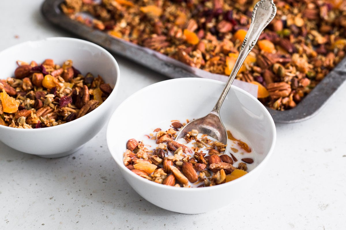 A delicious Grain Free Granola made with Mixed Nuts, Coconut Oil, Vanilla and Orange Zest. Gluten Free, Dairy Free and ready in under 1 hour. #granola #breakfast #cereal #glutenfree #easy #pecan #pistachio #almonds #apricot #cranberry #healthy #sunflowerseeds #breakfastrecipes #brunch