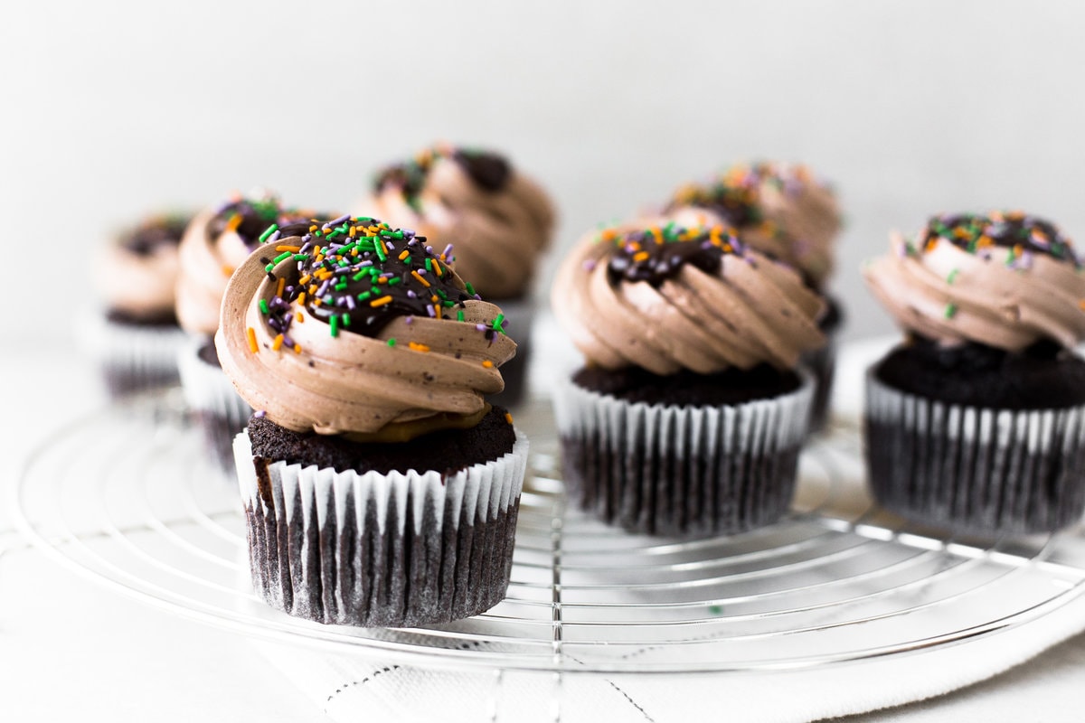 The Ultimate Vegan Chocolate Cupcakes. Tender Chocolate Cake filled with Chocolate Ganache and loaded with Vegan Chocolate Buttercream Frosting. #vegan #chocolate #cupcakes #cake #baking #dairyfree #ganache #buttercream #veganbaking #plantbased