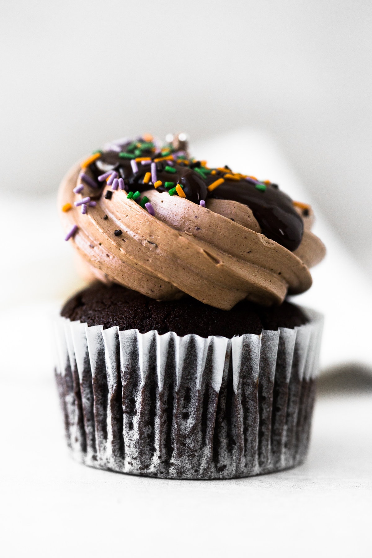 The Ultimate Vegan Chocolate Cupcakes. Tender Chocolate Cake filled with Chocolate Ganache and loaded with Vegan Chocolate Buttercream Frosting. #vegan #chocolate #cupcakes #cake #baking #dairyfree #ganache #buttercream #veganbaking #plantbased