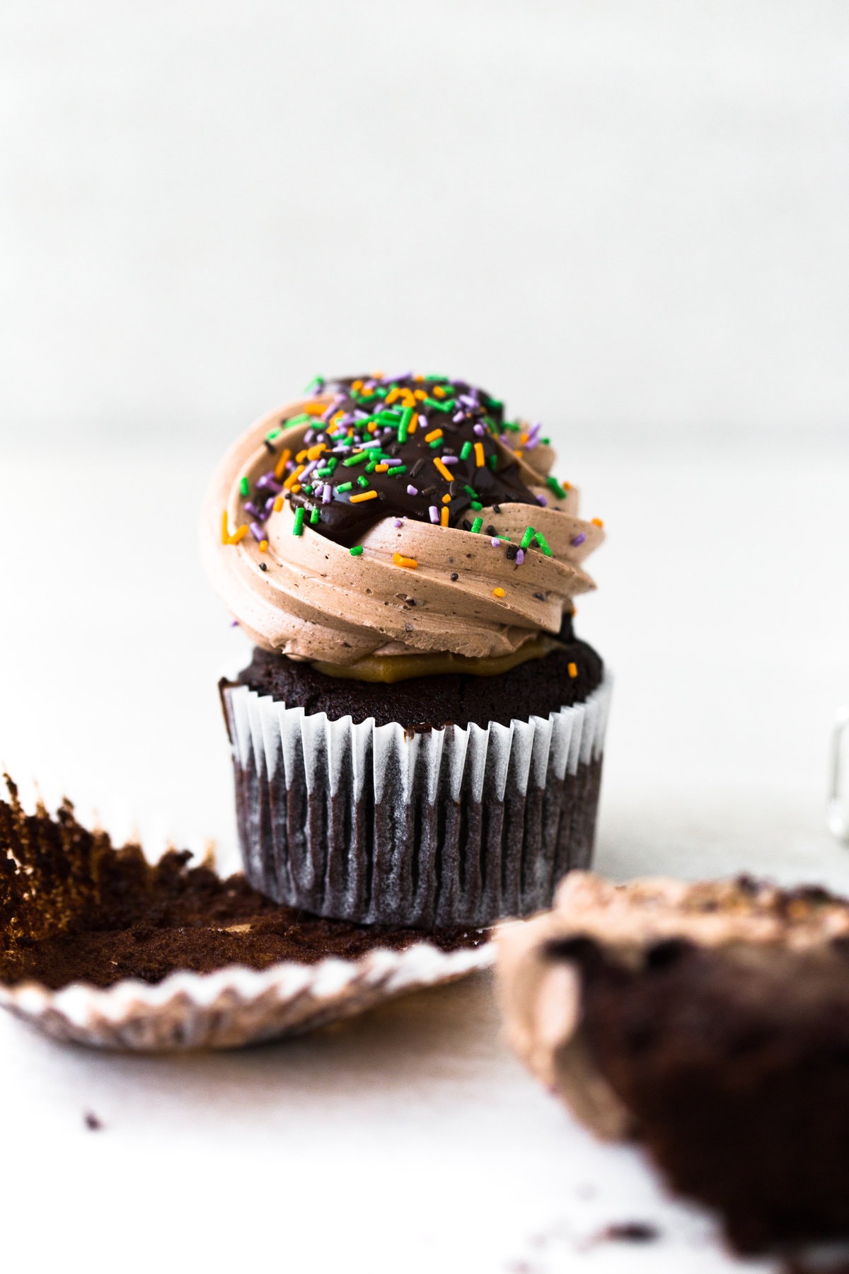 The Ultimate Vegan Chocolate Cupcakes. Tender Chocolate Cake filled with Chocolate Ganache and loaded with Vegan Chocolate Buttercream Frosting. #vegan #chocolate #cupcakes #cake #baking #dairyfree #ganache #buttercream #veganbaking #plantbased
