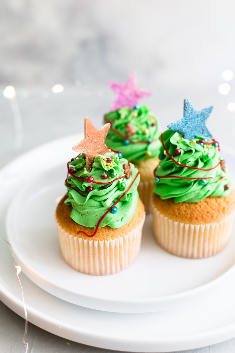 Tender and delicious Vegan Vanilla Cupcakes that everyone will love. Iced with Vanilla Buttercream Frosting and perfect for birthdays. #vegan #cupcakes #dessert #cake #vegancupcakes #vanilla #christmas #xmas #holidays #baking #veganbaking