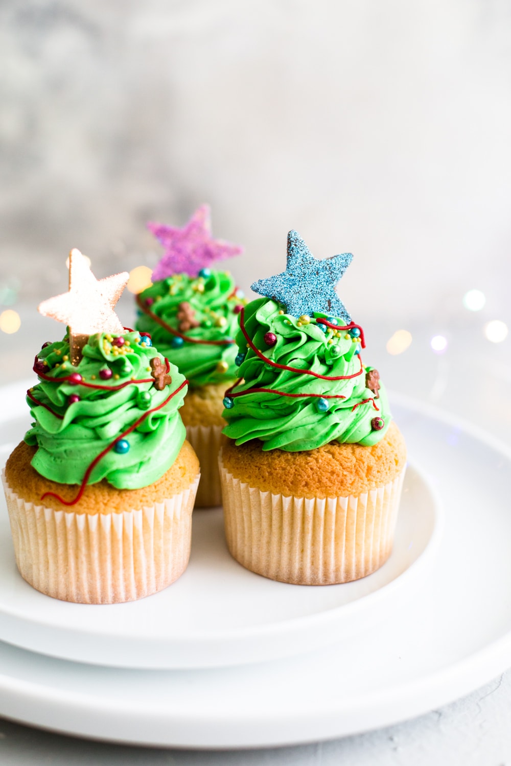 Tender and delicious Vegan Vanilla Cupcakes that everyone will love. Iced with Vanilla Buttercream Frosting and perfect for birthdays. #vegan #cupcakes #dessert #cake #vegancupcakes #vanilla #christmas #xmas #holidays #baking #veganbaking