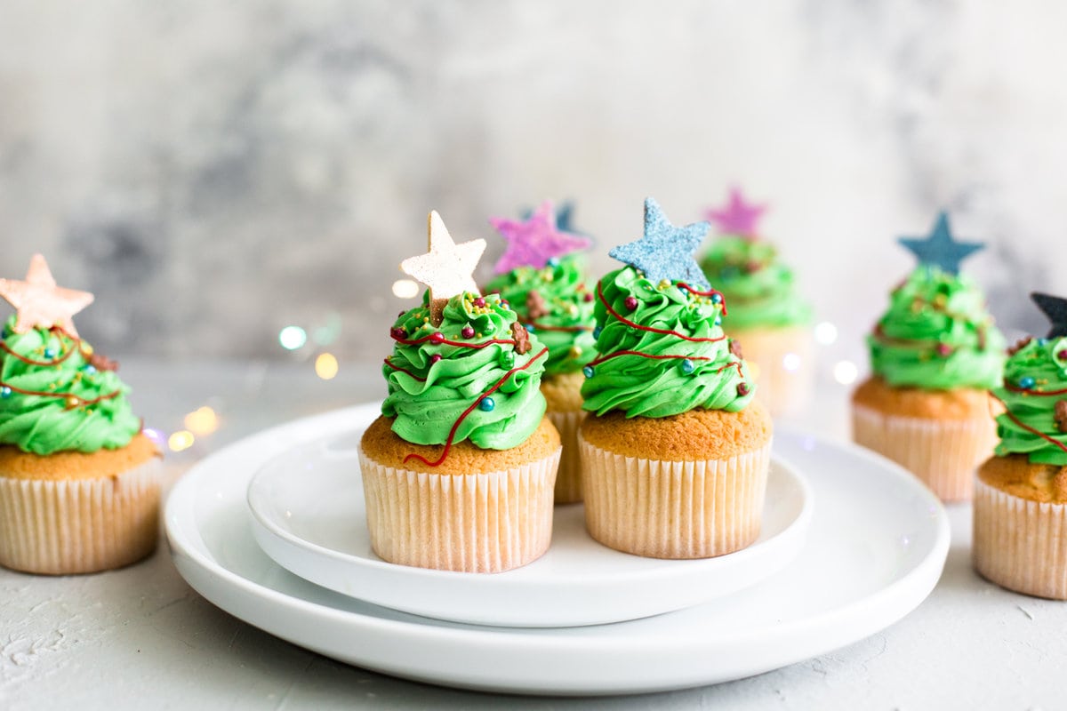 Tender and delicious Vegan Vanilla Cupcakes that everyone will love. Iced with Vanilla Buttercream Frosting and perfect for birthdays. #vegan #cupcakes #dessert #cake #vegancupcakes #vanilla #christmas #xmas #holidays #baking #veganbaking