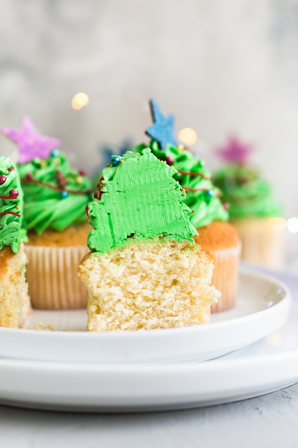 Tender and delicious Vegan Vanilla Cupcakes that everyone will love. Iced with Vanilla Buttercream Frosting and perfect for birthdays. #vegan #cupcakes #dessert #cake #vegancupcakes #vanilla #christmas #xmas #holidays #baking #veganbaking