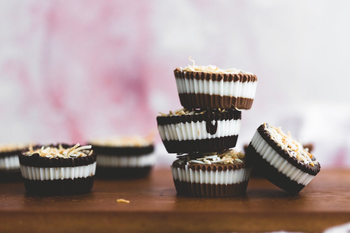 These 2 Ingredient Chocolate Coconut Butter Cups filled with homemade Coconut Butter are an amazing alternative to the regular Peanut Butter Cup! #vegan #coconut #peanutbuttercup #chocolate #simple #easy #nobake #dessert #kids #healthy