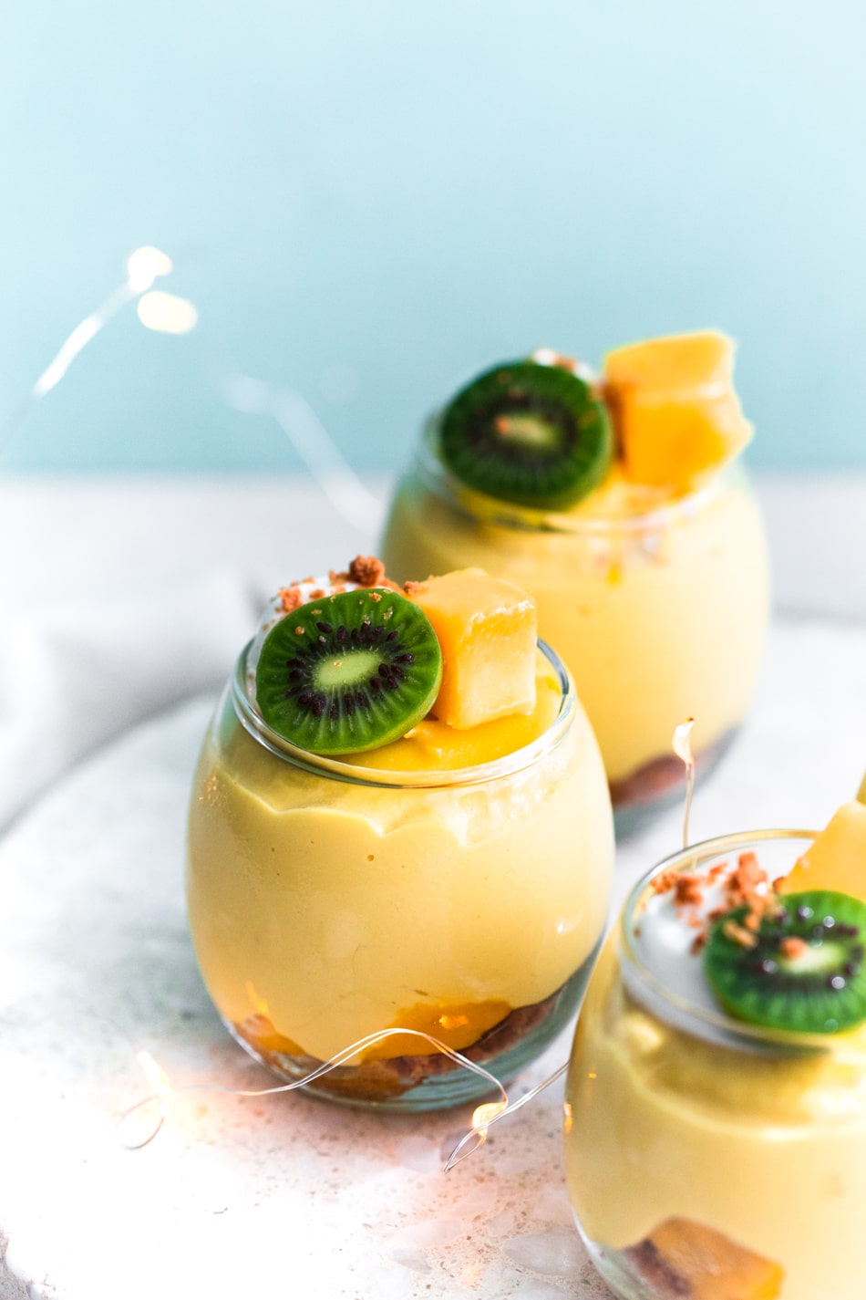 A delicious and fresh No-Bake Vegan Mango Cheesecake that tastes like summer in a cup. Refined Sugar Free, Dairy-Free and simple to make. #vegan #mango #cheesecake #dessert #dairyfree #mangocream #pudding #vegancheesecake #veganmangodesserts #dessert #crueltyfree #simple #vitamix 