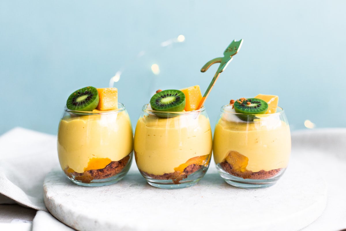 A delicious and fresh No-Bake Vegan Mango Cheesecake that tastes like summer in a cup. Refined Sugar Free, Dairy-Free and simple to make. #vegan #mango #cheesecake #dessert #dairyfree #mangocream #pudding #vegancheesecake #veganmangodesserts #dessert #crueltyfree #simple #vitamix 