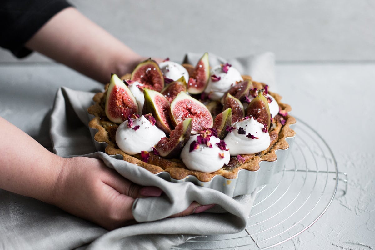 A delicious Vegan Fig Tart with a sweet pastry crust filled with Fig Jam, Vegan Almond Frangipane and topped with Vegan Whipped Cream. #fig #tart #vegan #almond #frangipane #fruittart #dairyfree #simple #easy #plantbased #almondpaste
