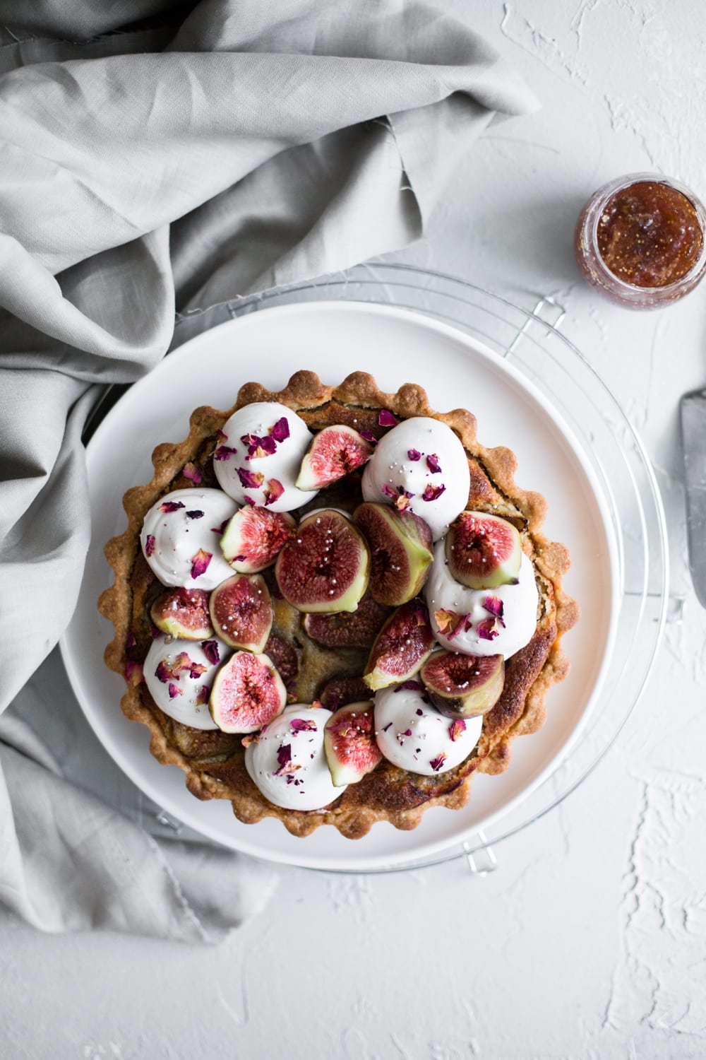 A delicious Vegan Fig Tart with a sweet pastry crust filled with Fig Jam, Vegan Almond Frangipane and topped with Vegan Whipped Cream. #fig #tart #vegan #almond #frangipane #fruittart #dairyfree #simple #easy #plantbased #almondpaste