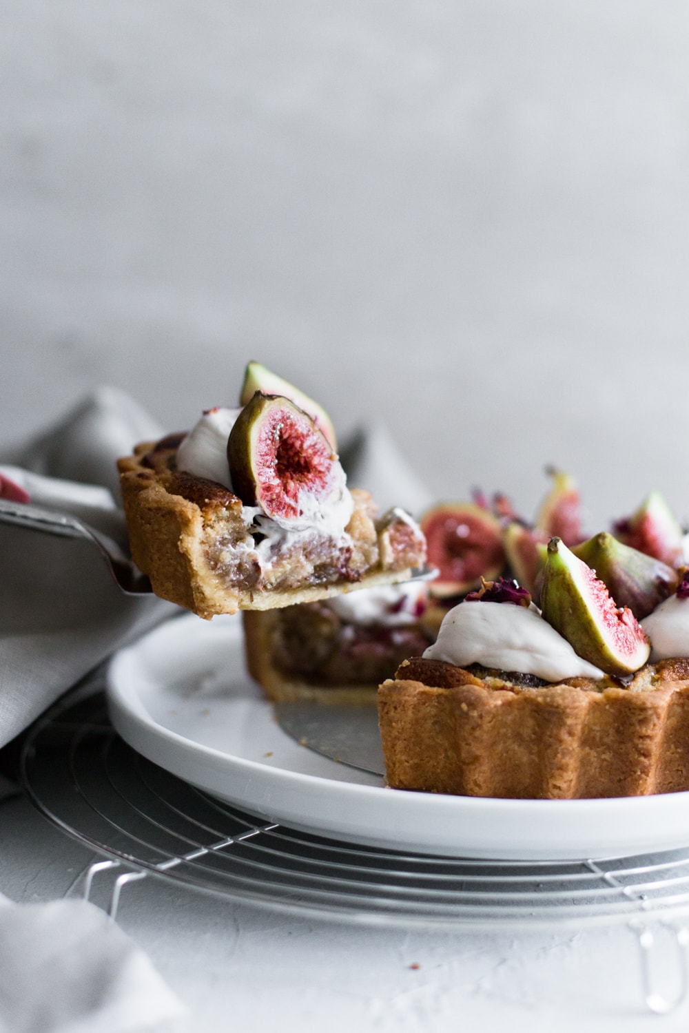 A delicious Vegan Fig Tart with a sweet pastry crust filled with Fig Jam, Vegan Almond Frangipane and topped with Vegan Whipped Cream. #fig #tart #vegan #almond #frangipane #fruittart #dairyfree #simple #easy #plantbased #almondpaste